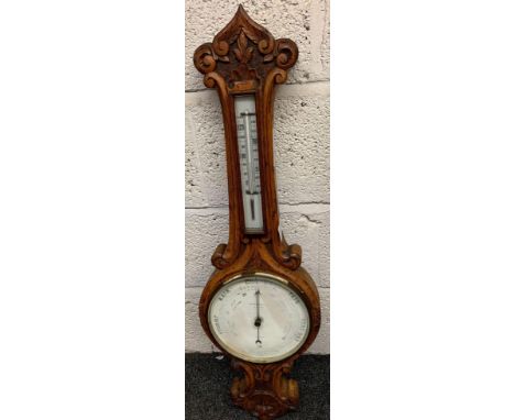 WALL BAROMETER BY A.FURTWANGLER, IN DECORATIVELY CARVED OAK CASE