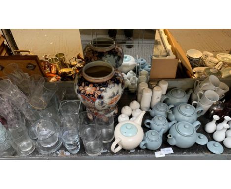 SHELF OF ITEMS INCLUDING GLASSWARE, TEAPOTS, CUPS AND SAUCERS, CRUETS ETC