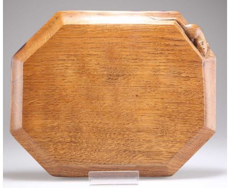 ROBERT THOMPSON OF KILBURN, A MOUSEMAN OAK BREAD BOARD of elongated octagonal form, with carved mouse signature. 30.4cm by 24