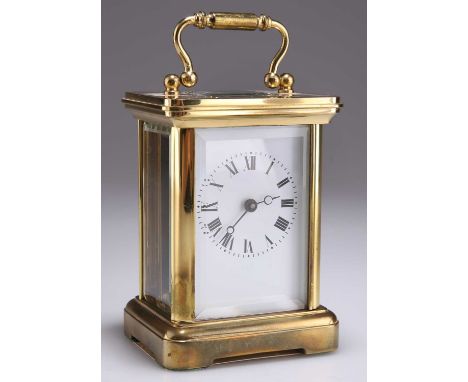 A 20TH CENTURY BRASS CASED CARRIAGE CLOCK signed Rapport, London, MTV No 1800. 12.5cm highNo key, door hangs ajar, some spott
