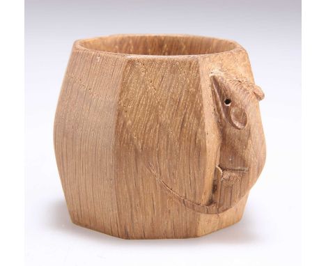 ROBERT THOMPSON OF KILBURN, A MOUSEMAN OAK NAPKIN RING shaped octagonal, with carved mouse signature. 4.8cm high