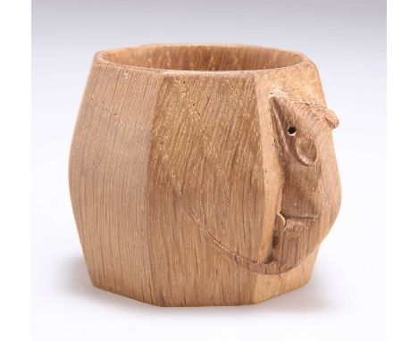 ROBERT THOMPSON OF KILBURN, A MOUSEMAN OAK NAPKIN RING shaped octagonal, with carved mouse signature. 4.8cm high