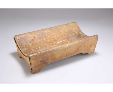 A ROWLAND WARD TUSK STAND late 19th/early 20th Century, formed from a heavy hide with gilt beaded trim, the underside with an