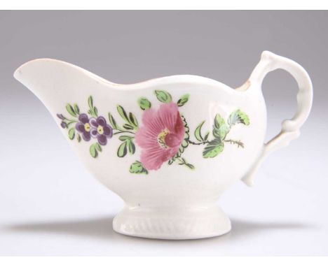 A CAUGHLEY CREAMER c.1785, Worcester decorated with sprigs of flora. 11cm longGood condition