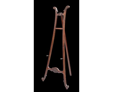 A PERIOD STYLE EASEL carved with leaves and a scallop shell, modern. 184.5cm highSome light surface scratching and scuffing t