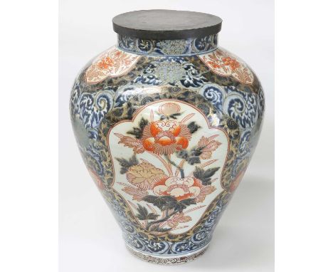 A LARGE JAPANESE IMARI VASE Edo period, of baluster form, now with a metal cover. 40cm highMetal cover detaches. An underglaz