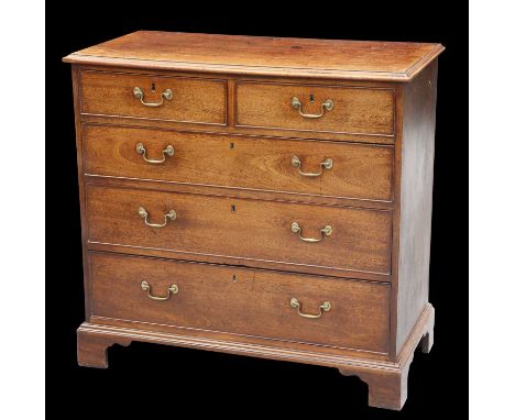 A GEORGE III MAHOGANY CHEST OF DRAWERS the rectangular top with moulded edge, above two short over three long graduated drawe