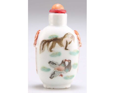 A CHINESE PORCELAIN SNUFF BOTTLE  shouldered form with mask handles, painted in colours with a cricket perched upon an upturn