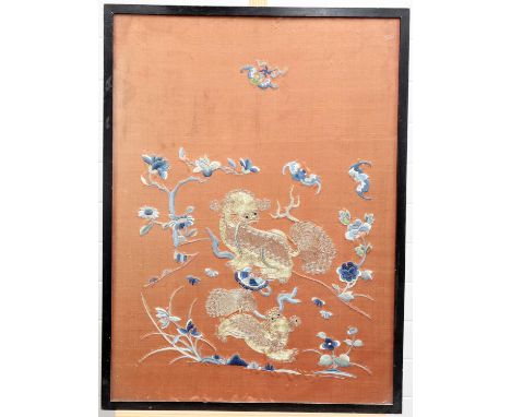 A CHINESE SILK PANEL depicting foo dogs and bats, framed. Frame 79cm by 59cm