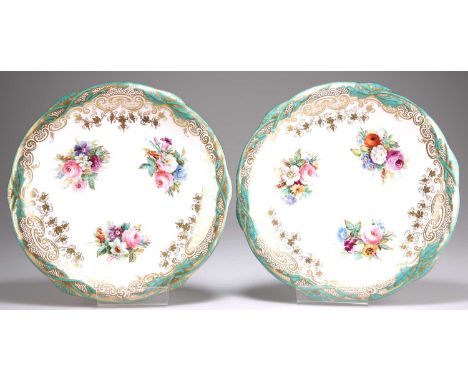 A PAIR OF 19TH CENTURY DAVENPORT LONGPORT DESSERT PLATES painted with clusters of flowers within green and gilt foliate scrol