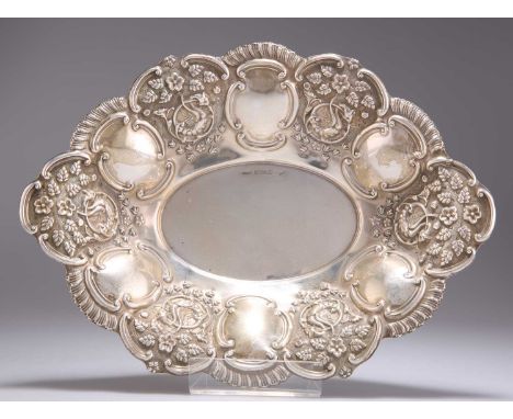 AN EDWARDIAN SILVER BON-BON DISH by Charles Westwood &amp; Sons, Birmingham 1905, shaped oval, the flared sides chased with C