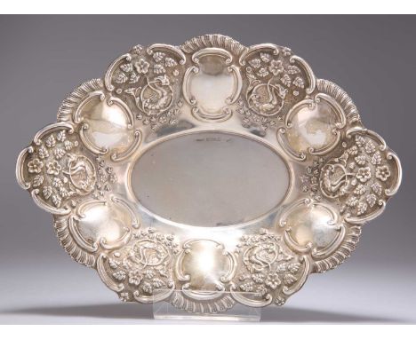 AN EDWARDIAN SILVER BON-BON DISH by Charles Westwood &amp; Sons, Birmingham 1905, shaped oval, the flared sides chased with C