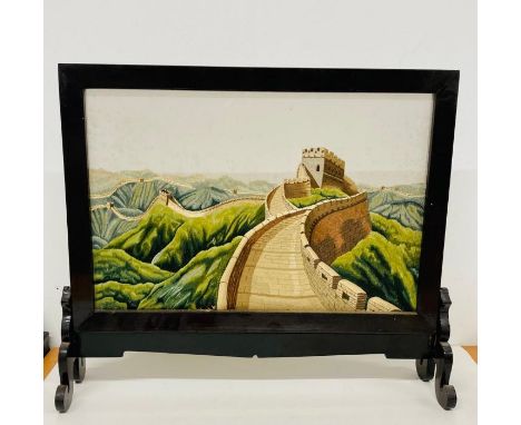 A fire screen with a tapestry of the Great Wall of China