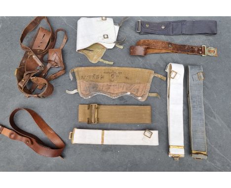 A vintage British military Sam Brown belt, with shoulder strap, whistle and sword frog; together with various other leather b