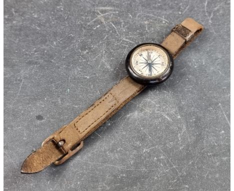 A vintage wrist compass, 25mm, with leather strap. 