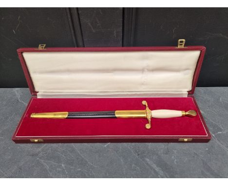 A cased Wilkinson Sword 1972 bicentennial presentation dagger and sheath,&nbsp;the 27.5cm blade etched, the box mounted with 