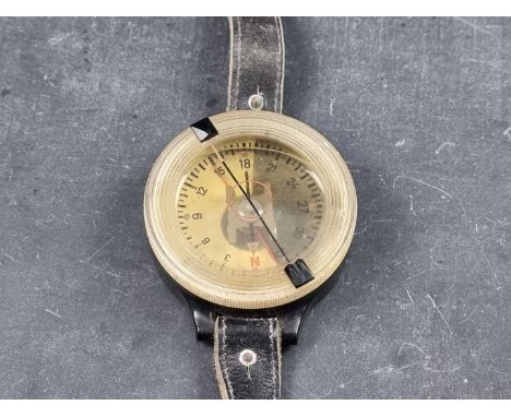 A WWII German Luftwaffe AK 39 wrist compass, No.F1 23235-1, with leather strap, 62mm. 