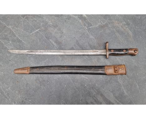 A WWI British 1913 pattern bayonet and scabbard, with 43cm blade stamped 'Remington 1917'.