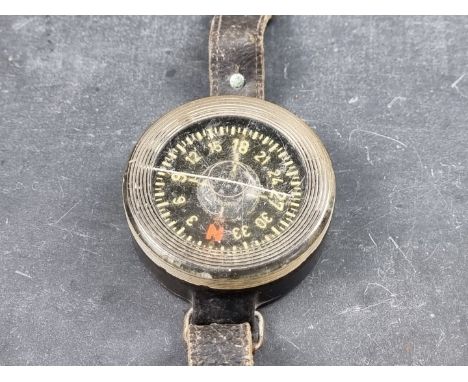 A WWII German Luftwaffe AK39 wrist compass, by Kadlec, No.F1 23235, with leather strap, 62mm. 
