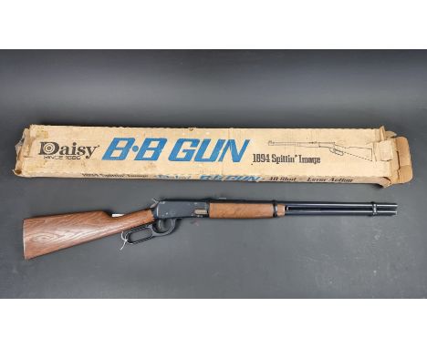 A vintage Daisy Winchester model 1894 'Spittin Image' 3030 .177 cal BB rifle, boxed.