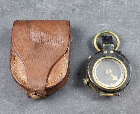 A WWI British Verners Pattern VII officer's military compass, by E Koehn Geneva, dated 1915 with broad arrow mark, in leather