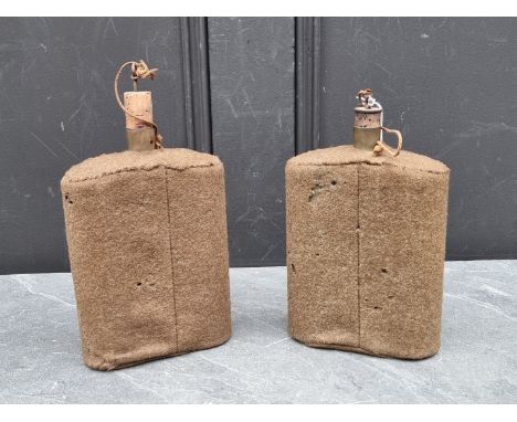 Two WWII British army water canteens, both covered in khaki fabric, 21cm high including spout.