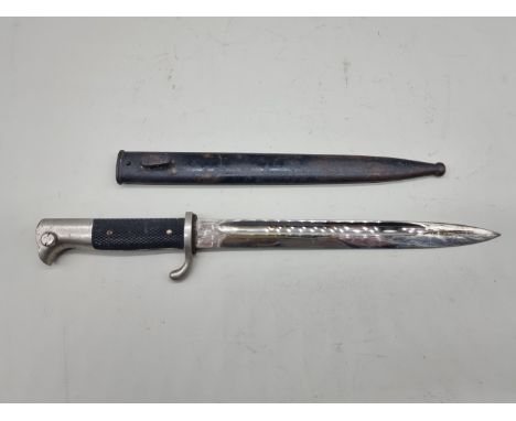 A German WWII parade bayonet and scabbard, by&nbsp;E F Horster Solingen, with 24.5cm blade.