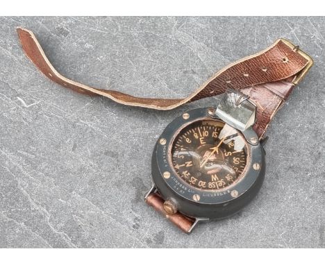 A circa 1940s aeronautical wrist compass, by Dent &amp; Co &amp; Johnson, Linwood, with leather strap. 