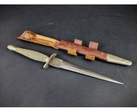 A rare circa 1940 Fairbairn-Sykes first pattern commando fighting knife and leather sheath,&nbsp;by Wilkinson Sword, the rica