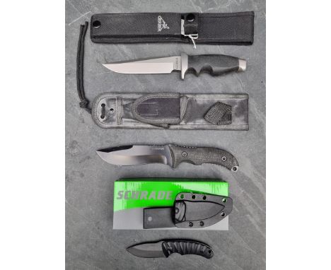 A Gerber hunting knife and sheath,&nbsp;having 15.5cm blade; together with a Schrade SCHF26 knife and sheath, having 14cm bla