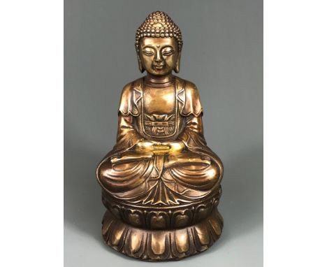 A Chinese cast bronze figure of a seated Buddha, H. 14cm.