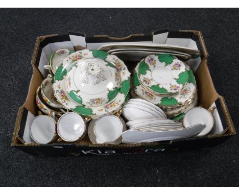 A box containing a Sandringham china tea and dinner service together with a Royal Stafford Roses to Remember tea service