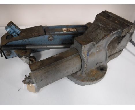A heavy duty bench vice together with a car jack
