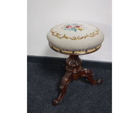 A Victorian mahogany tapestry upholstered tripod stool  
