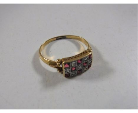 An 18ct gold ruby and diamond ring, size O.