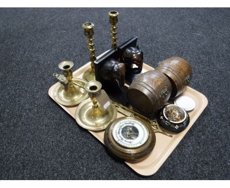 A tray of two pairs of brass candlesticks, brass toasting fork, circular barometer, pair of elephant bookends, pair of wooden