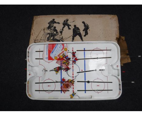 A boxed vintage Puck Master ice hockey game