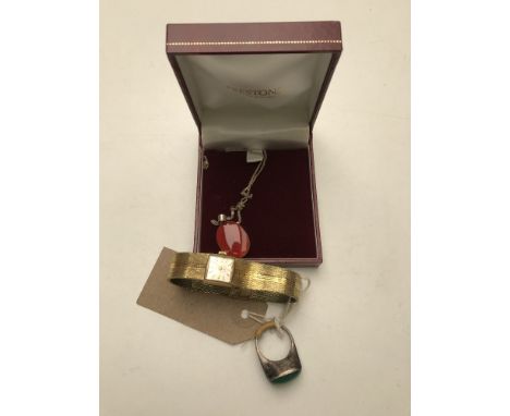 A silver polished jade ring together with a gilt metal wrist watch and a pendant on chain.