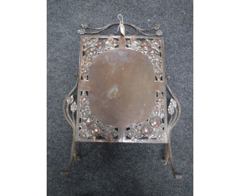 A copper Art Nouveau fire screen 