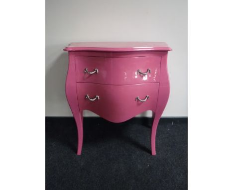 A pink two drawer commode chest 