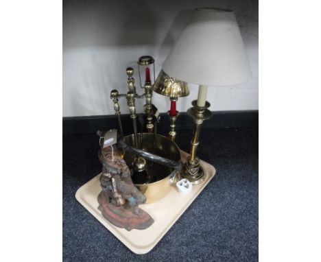 A tray of cast iron Mr Punch door stop, brass companion set, jam pan, brass table lamp with shade and two brass candlesticks 