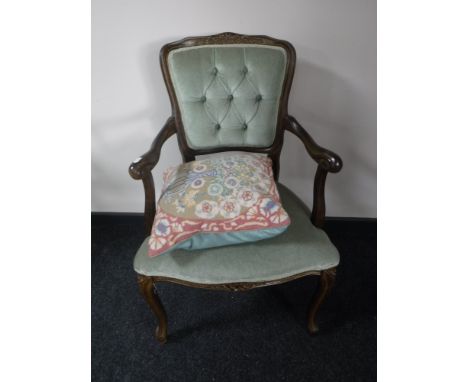 A French style armchair, upholstered in a green button dralon, together with a tapestry cushion 