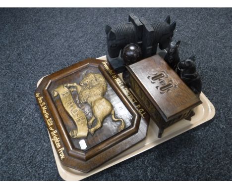 A tray of assorted wooden pieces including a musical trinket box in the form of a coffer, pair of horse head bookends, R. A. 