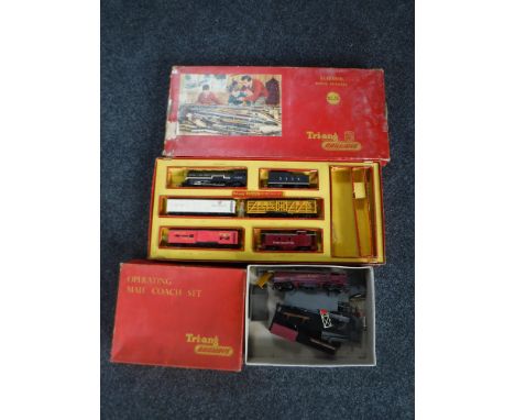 A vintage boxed Triang train set together with a box containing a Royal Mail coach and part buildings
