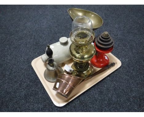 A tray of vintage scales and weights, converted Duplex oil lamp, hand bell, stone ware hot water bottle etc  