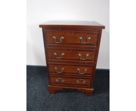 A mahogany Regency style four drawer chest on bracket feet