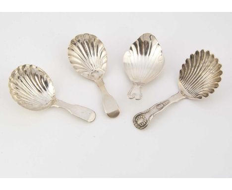 Four Georgian period silver tea caddy spoons, each with shell style bowl, the longest 10.1cm (4)
