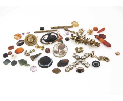 A collection of 19th century jewels and gems, including an agate button, agate bulls eye, carnelian inscribed seal, a paste s