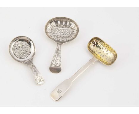 Three Georgian period silver pierced tea caddy spoons, one with oblong gilt pierced bowl, 9cm long, another with filigree inl