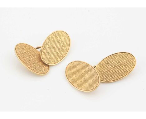 A pair of 18ct gold oval linked cufflinks,  oval links with engine turned design, 2 cm by 1.3 cm Birmingham 1946, 10g